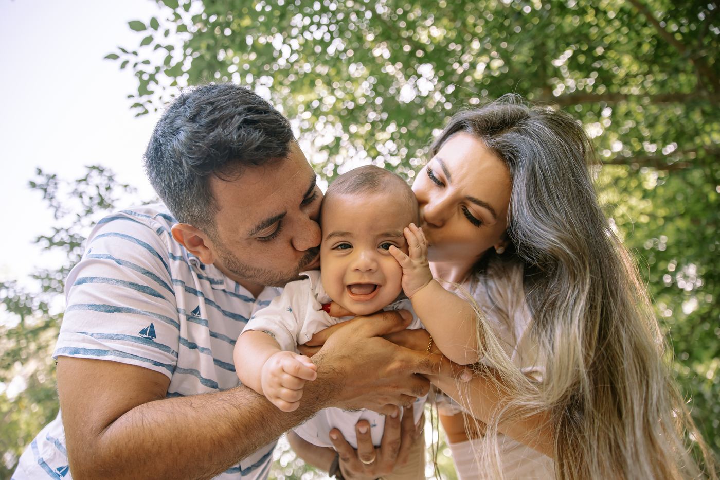 Family portrait on a white footbridge under the oaks — a favorite Southwest Florida session location