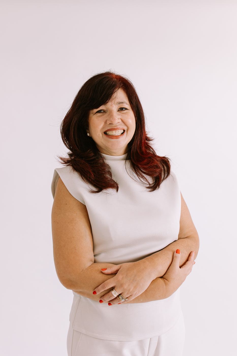 Warm smiling headshot in cream against a bright white backdrop, Southwest Florida branding photographer