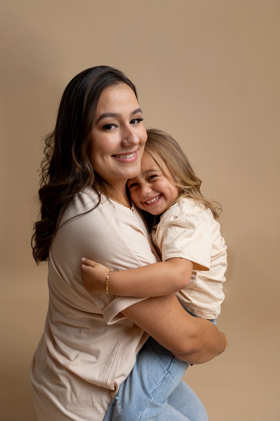 Mother and daughter wrapped in a hug during a mommy-and-me session by SWFL family photographer Ana Rousseau