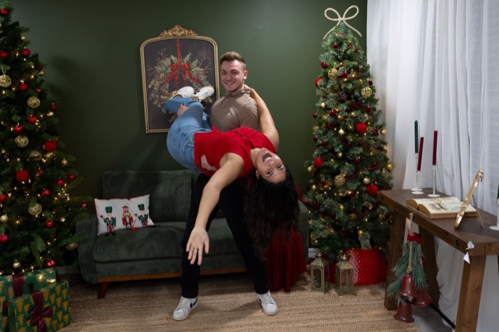Couple mid dance dip in the holiday studio set